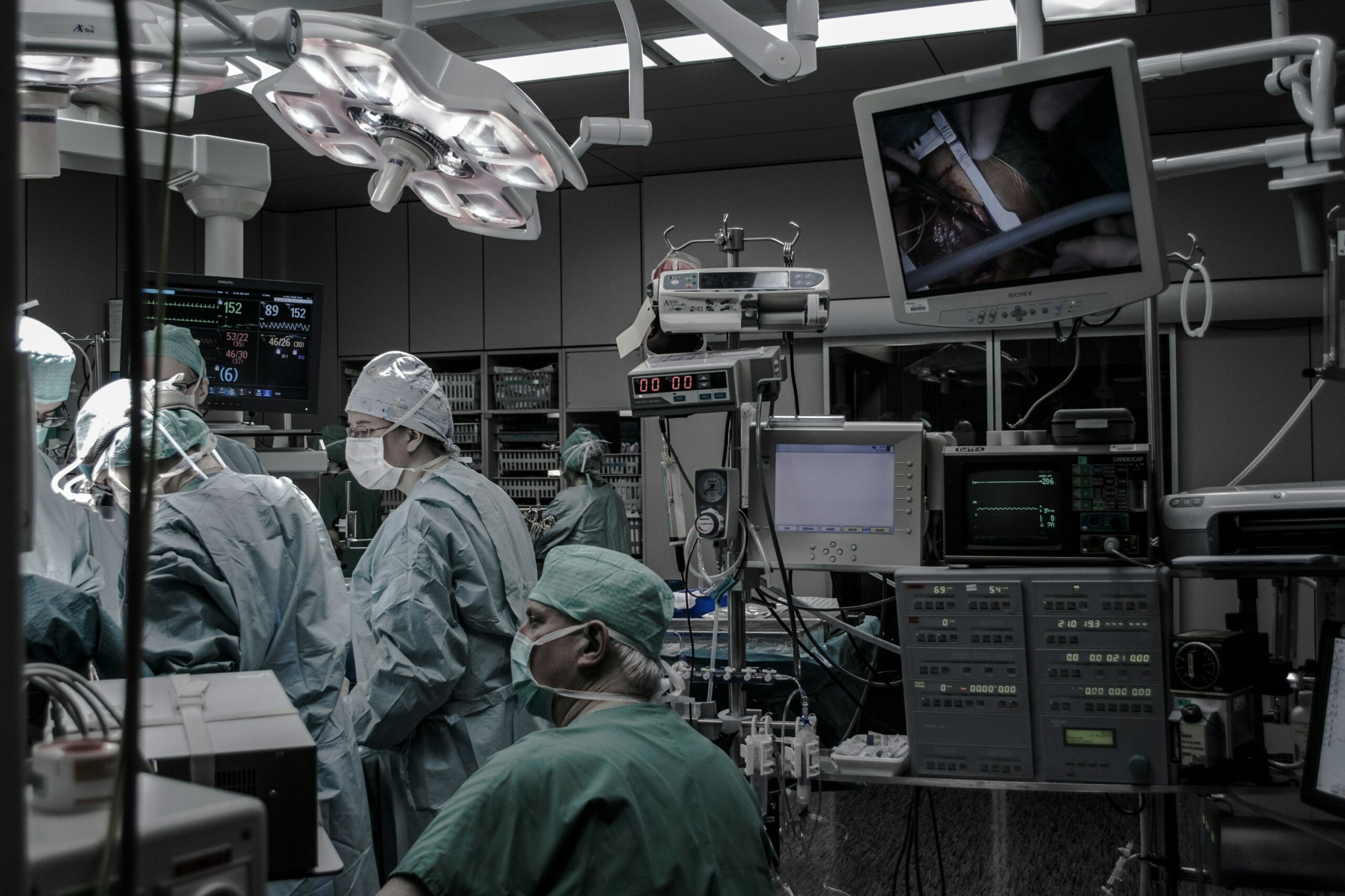 Medical device equipment in use during surgery Surgical team in an operating room with medical monitoring devices and equipment