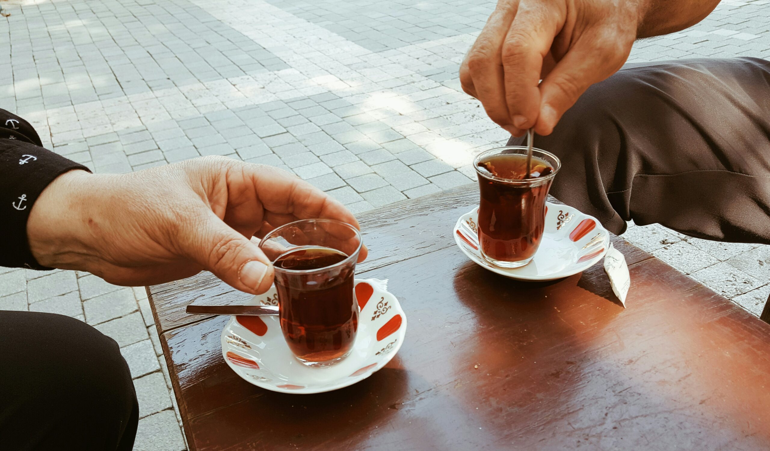 Turkish business culture European and Turkish business partners sharing tea during a meeting